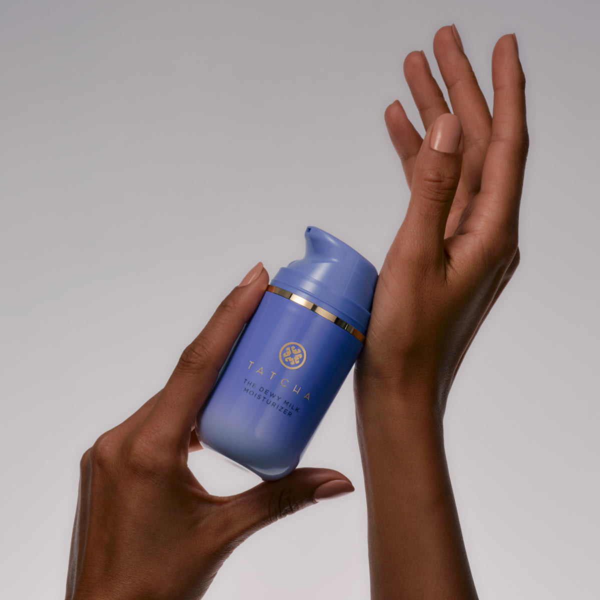 DewyMilkMoisturizer-Aug26-Ppage-HandHold.jpg